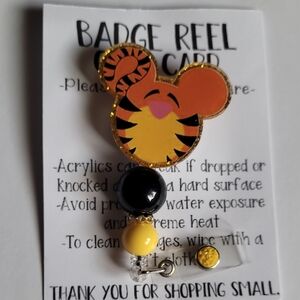 Hand Crafted Orange and Black Character Badge Reel